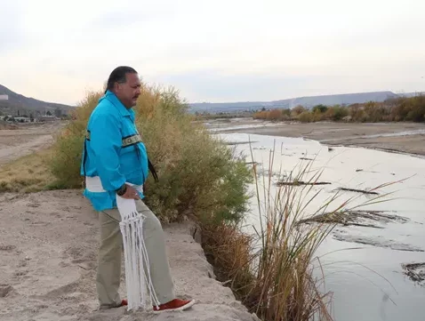Image of Rick Quezada, a Ysleta del Sur Pueblo tribe member, on the banks of the Rio Grande. Indigenous voices are included in the Chamizal National Memorial historic exhibit.