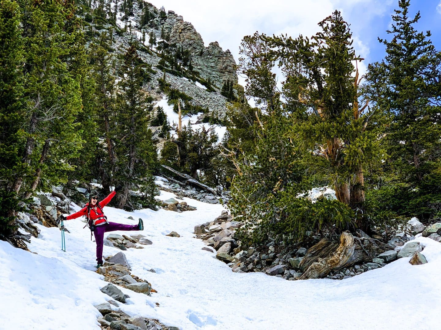 Hiker poses in a snowfield on Bristlecone Trail at Great Basin National Park