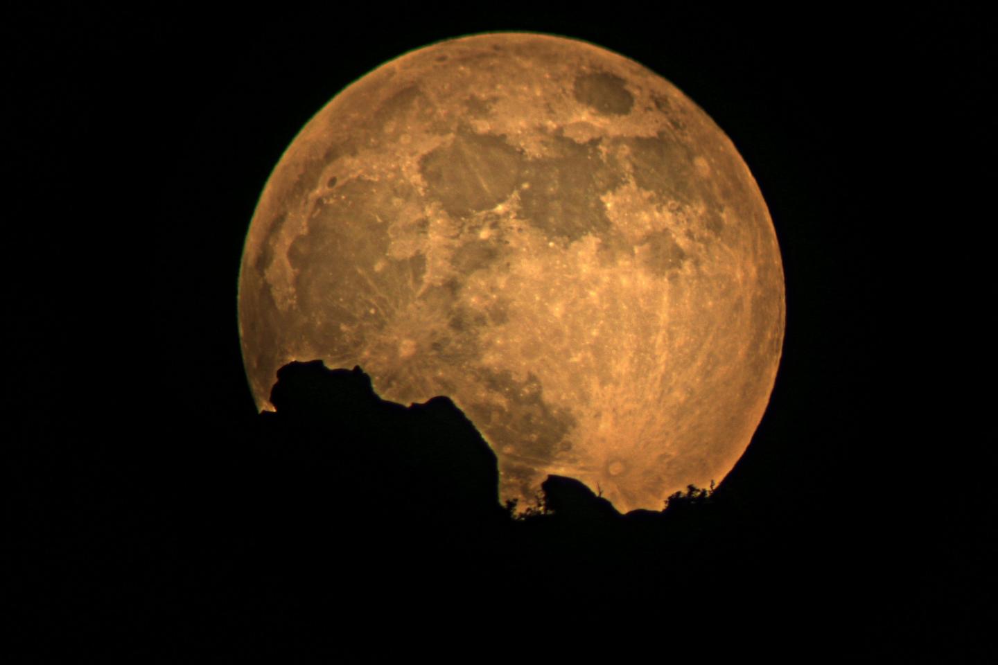 The full moon rises over Zion. Night sky photography is popular from the park, where dark skies give excellent views.