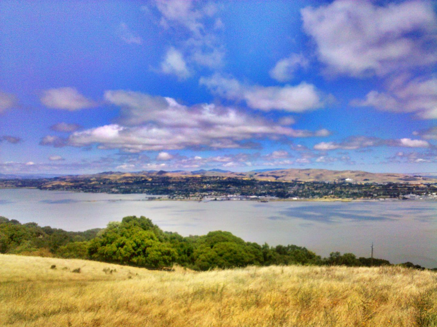 Carquinez Strait under a partly cloudy sky.