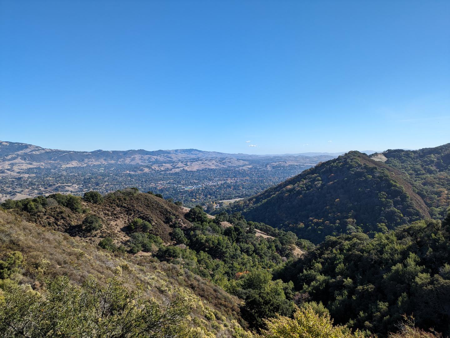 Mountain landscape under clear blue sky.