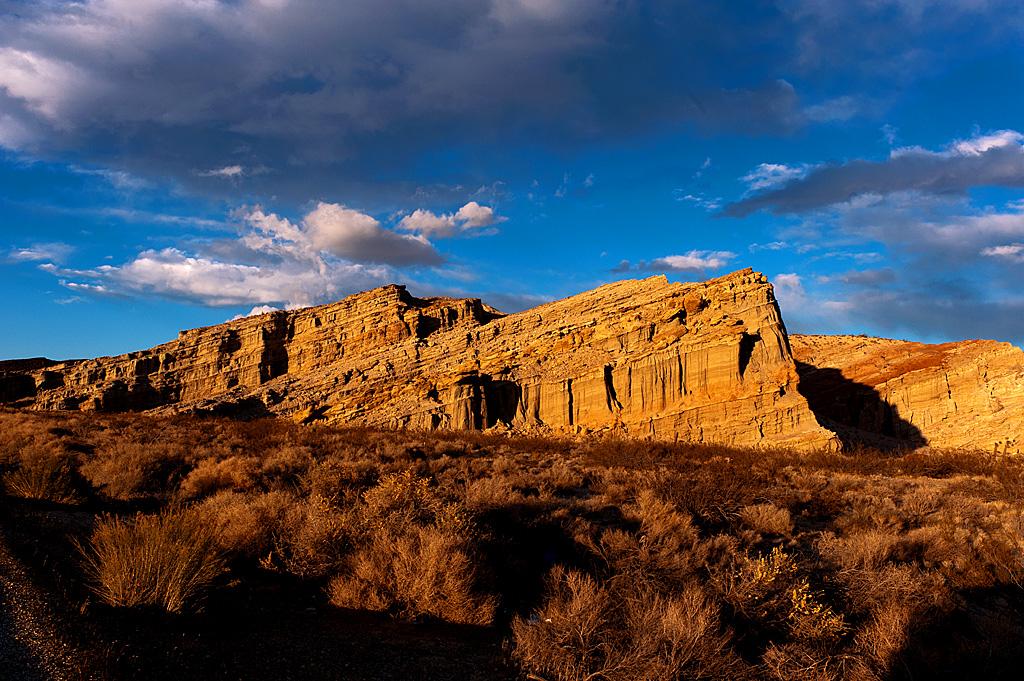 Red Rock Canyon under a blue sky with clouds.