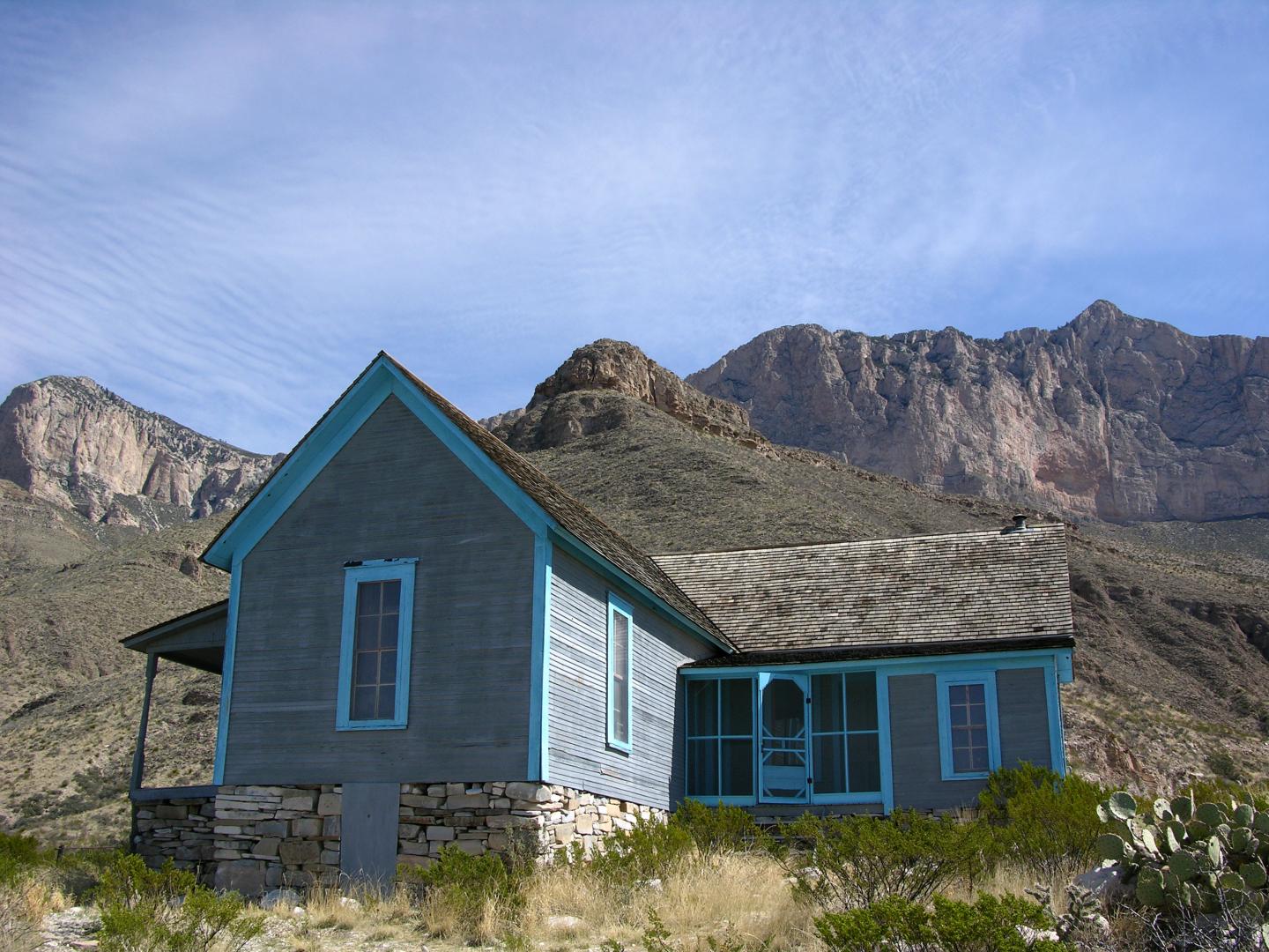 Williams's Ranch set against mountain backdrop under a clear sky.