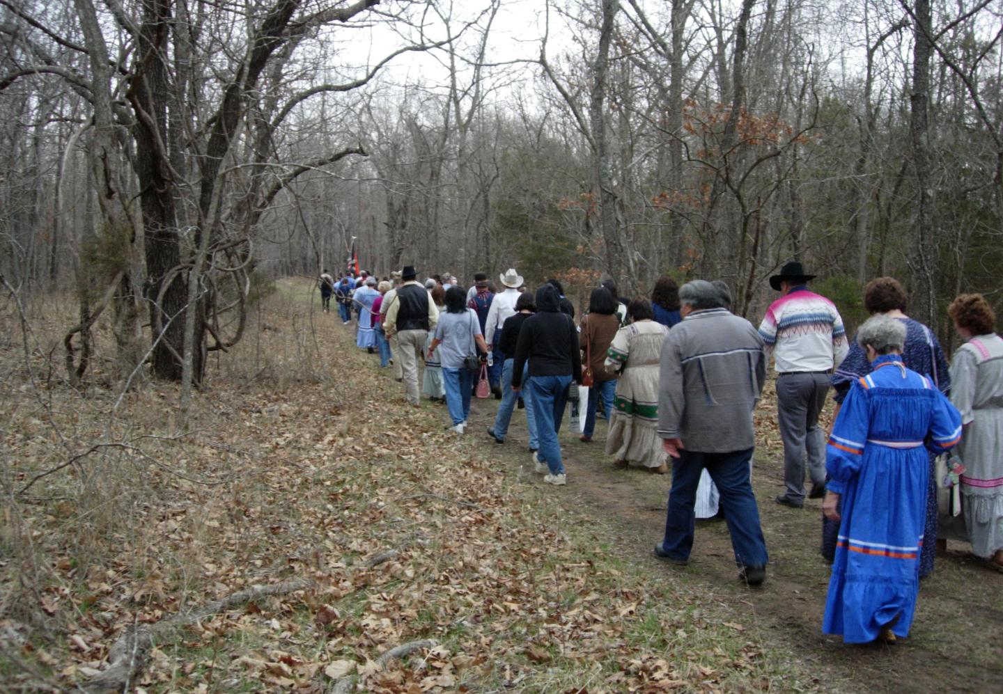 A group walking through the Trail of Tears in winter clothing.