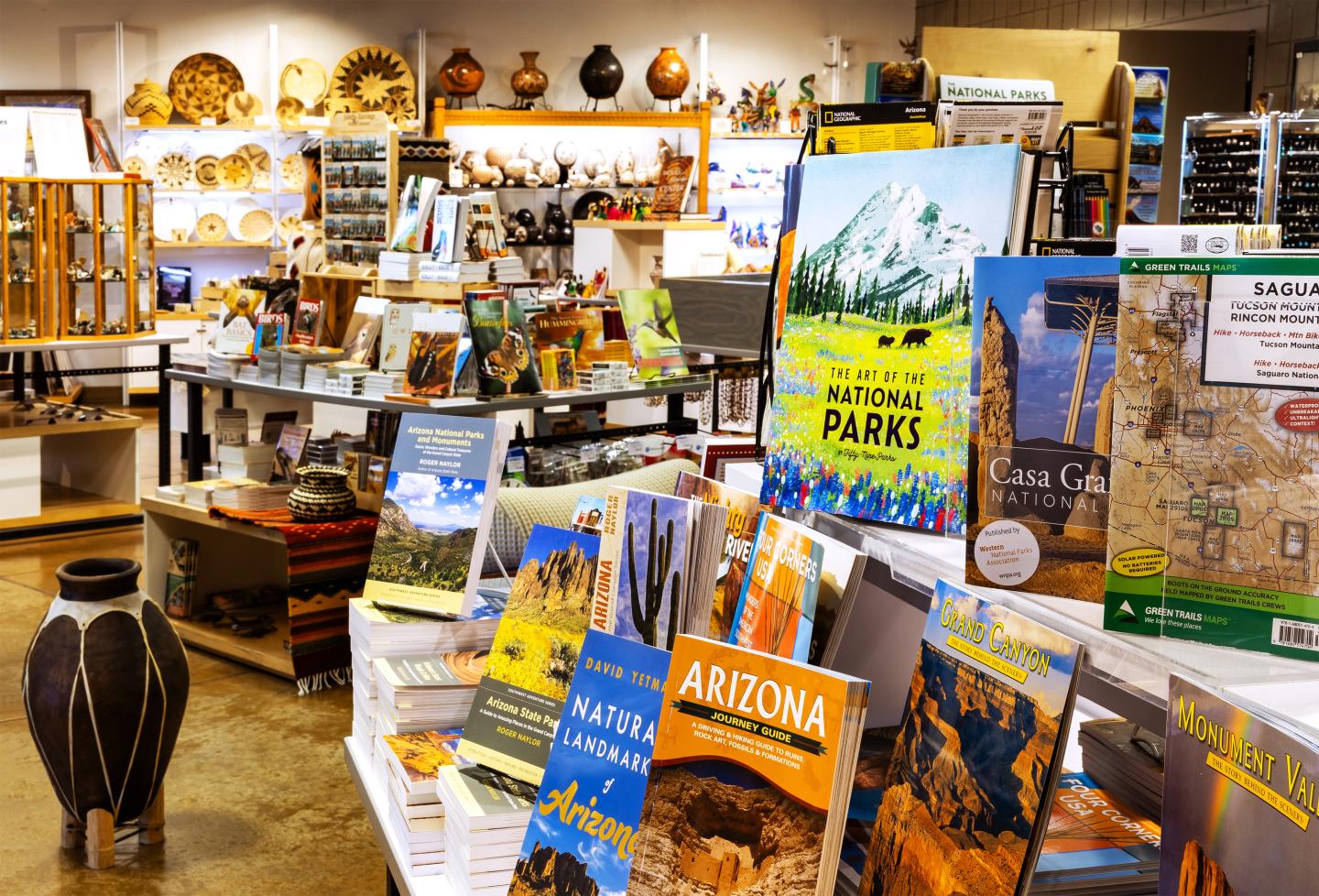 Books and souvenirs in a colorful store display.