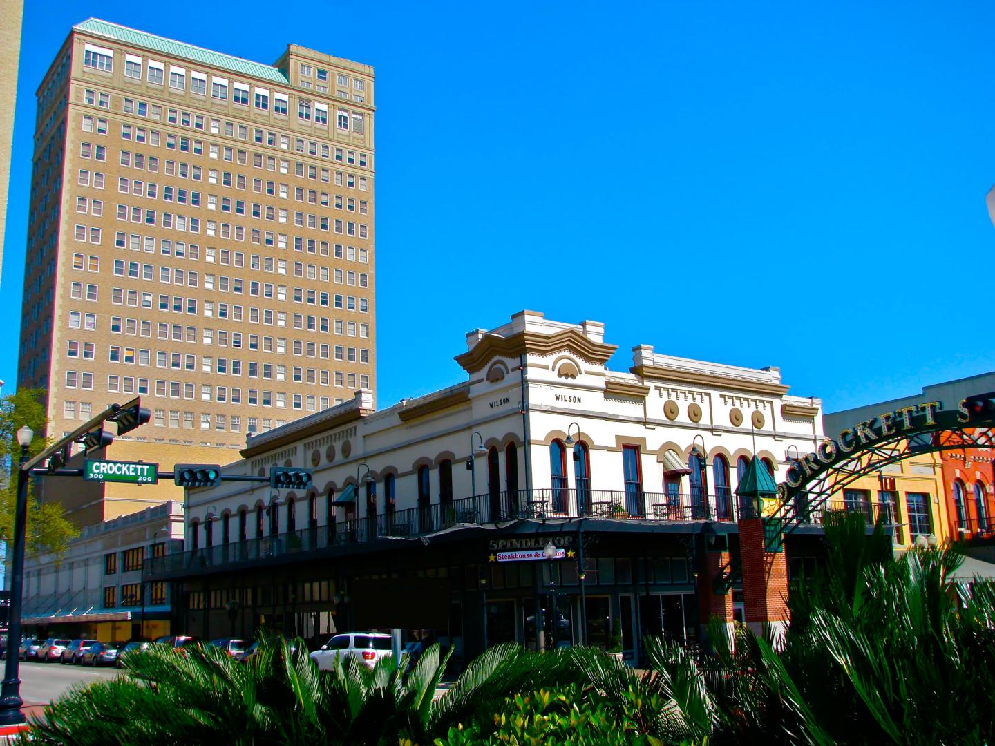 Historic downtown building under clear blue sky.
