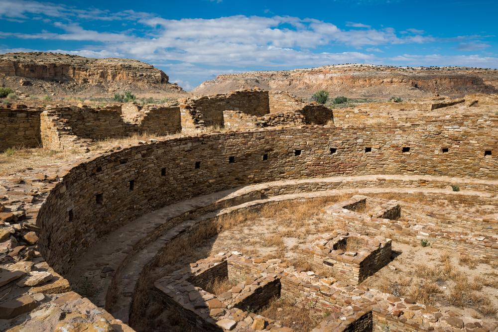 Ancient circular structure under a blue sky at Chaco Culture National Historical Park.