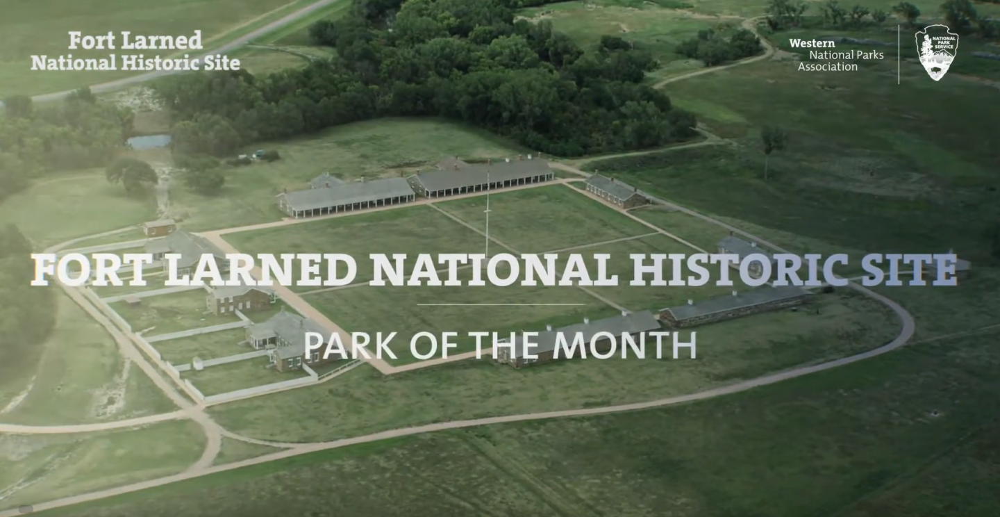 Aerial view of Fort Larned surrounded by green fields.