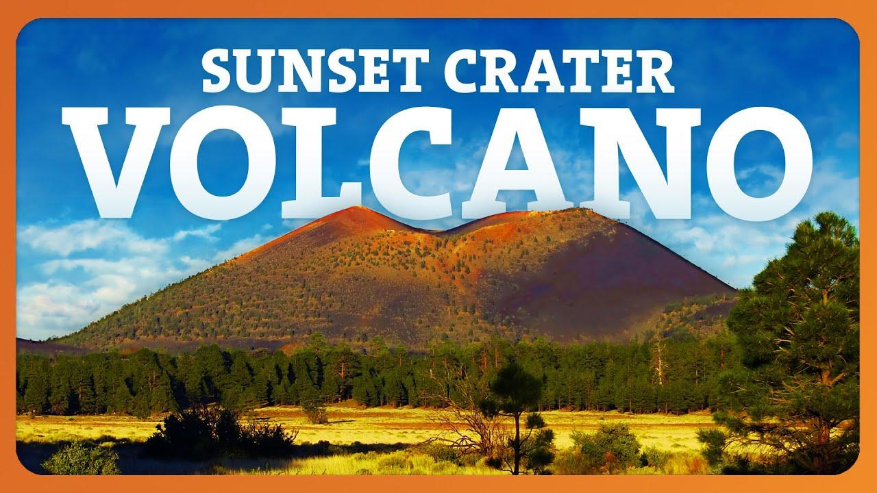 Sunset Crater Volcano, lush forest, blue sky.