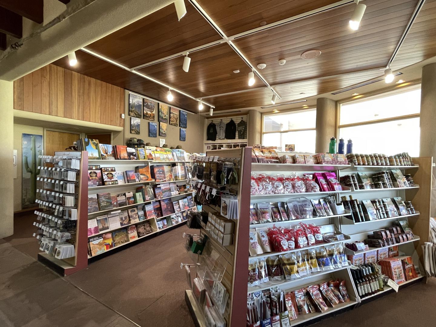 Store shelves filled with books, snacks, and souvenirs.