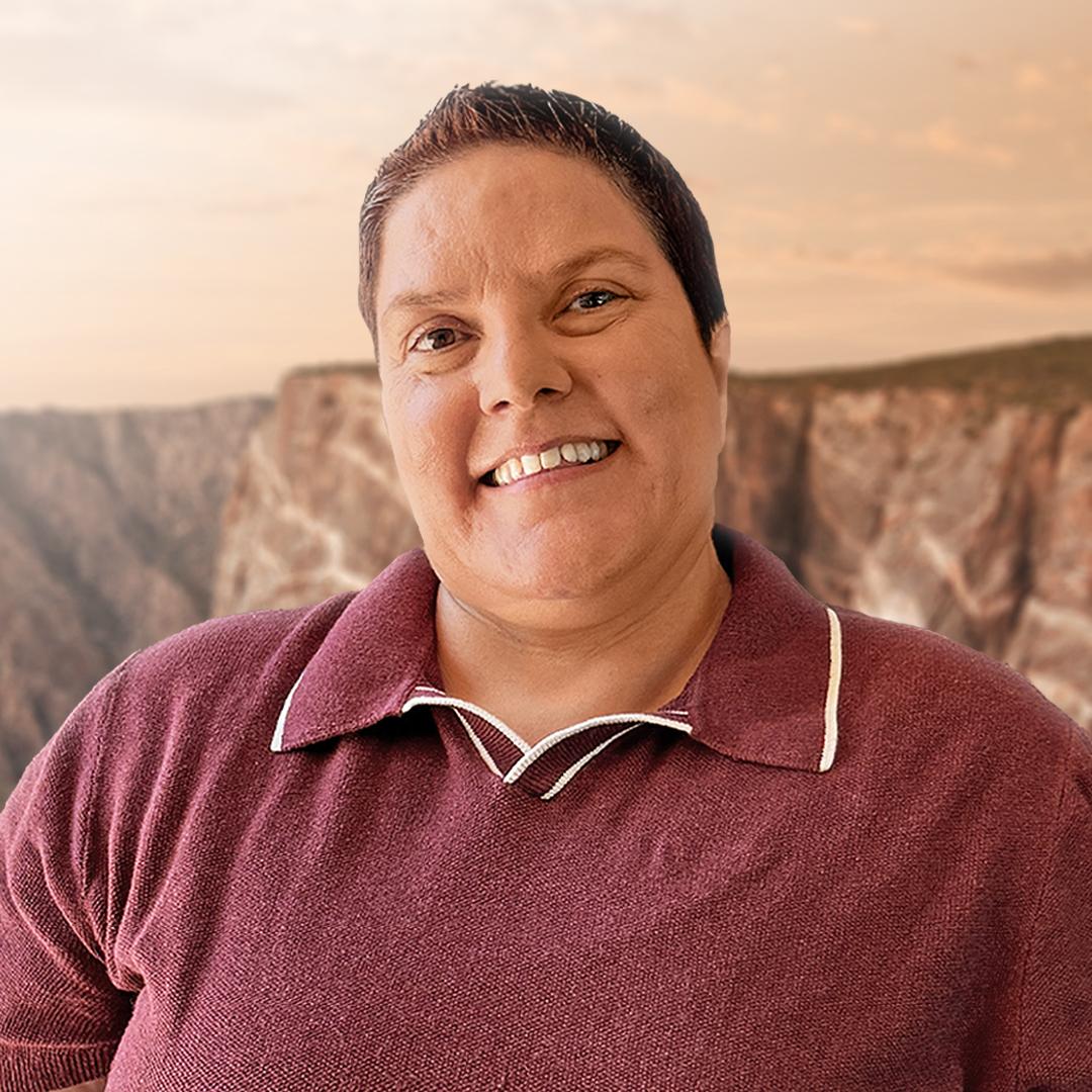 WNP Chief of Staff, Teresa Noon, in front of a scenic view of Black Canyon of the Gunnison at sunset.
