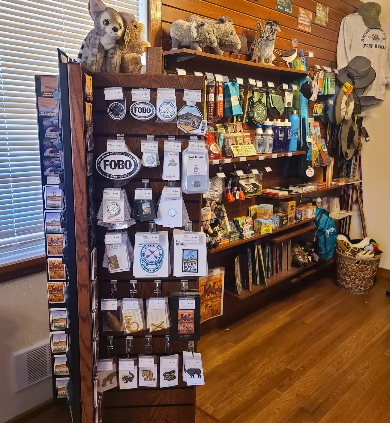 Gift shop interior with souvenirs and plush toys displayed on shelves.
