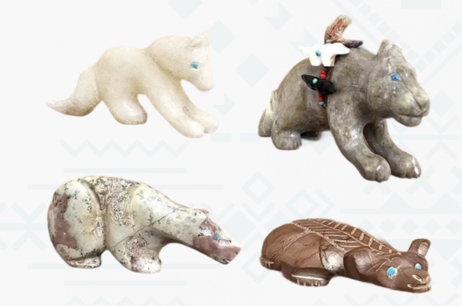 Four carved Zuni stone fetishes in various colors and postures.