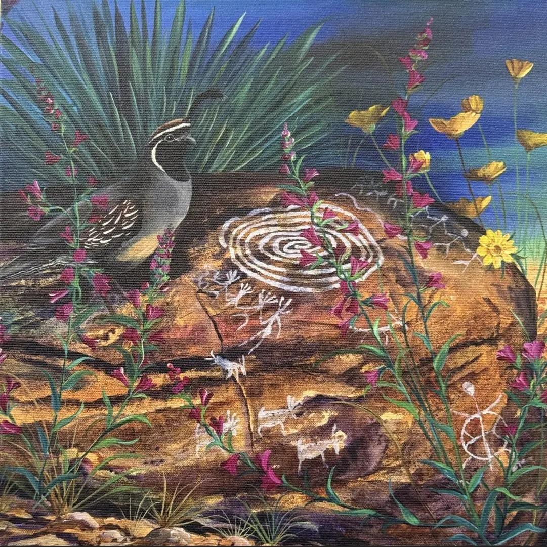Quail on a rock with petroglyphs, colorful flowers and desert plants under a blue sky.