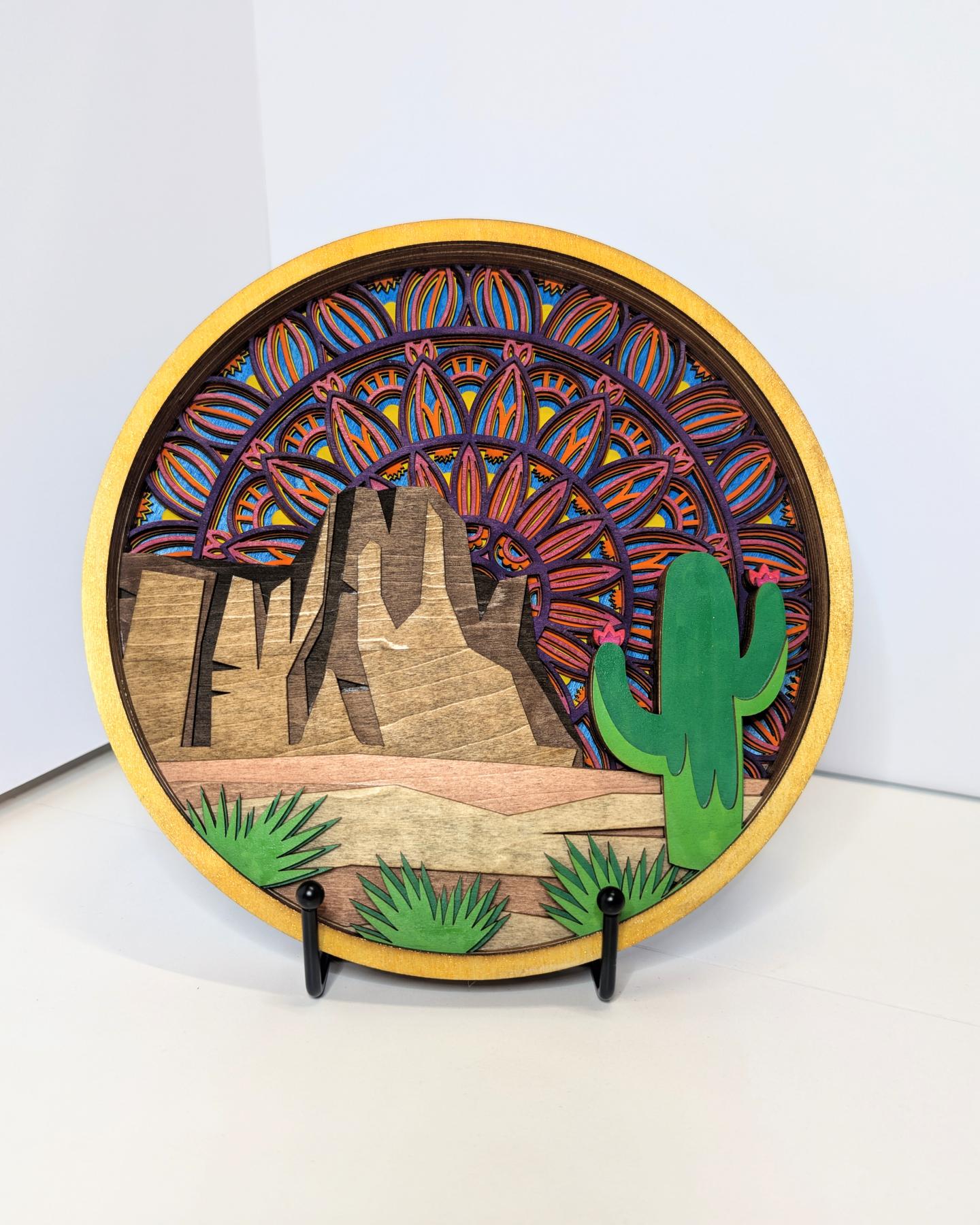 Decorative plate with desert scene and colorful patterns.