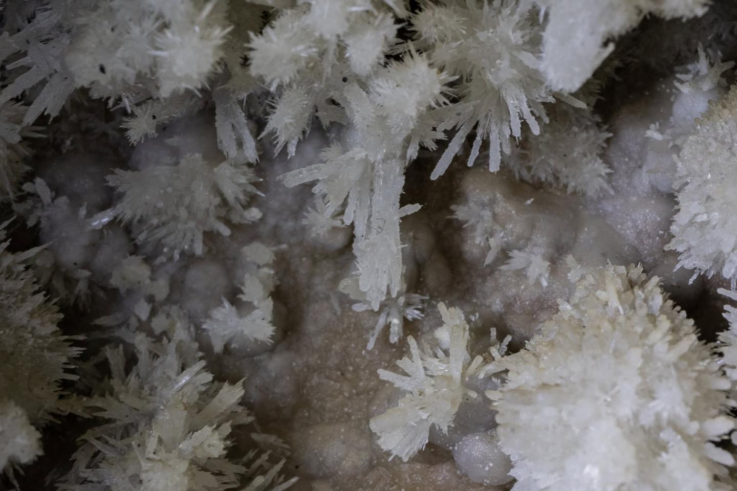 White cave crystals with spiky formations.