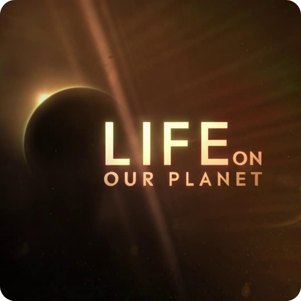 Space scene with a planet partially eclipsed, text reads "Life on Our Planet".