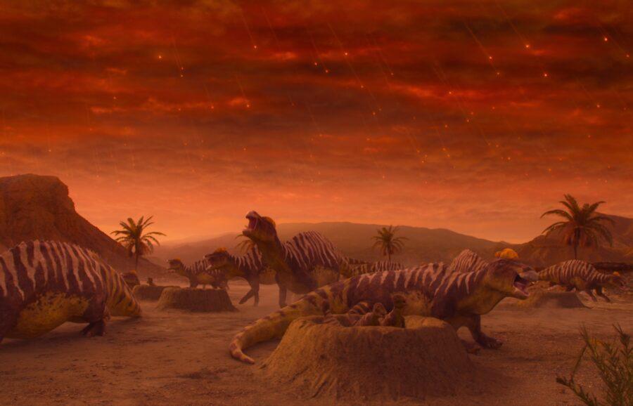 Dinosaurs in a desert at sunset with vibrant red sky.