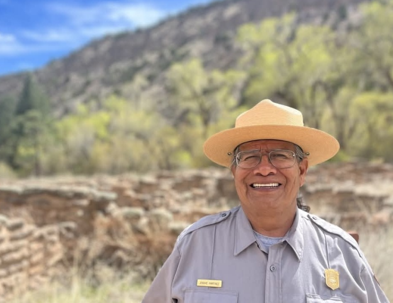 A smiling park ranger.