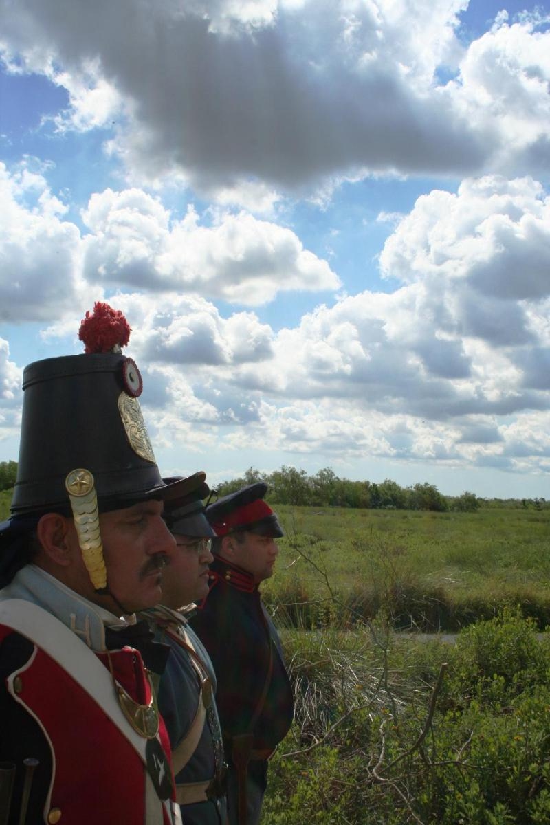 Three volunteers in Mexican War era military uniforms.