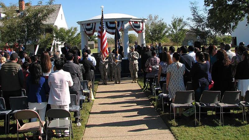 The Fort Scott Naturalization Ceremony with new citizens and a ROTC color guard.