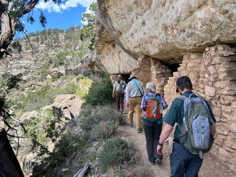 Participants walk along the Ranger Ledge Trail at Walnut Canyon National Monument.