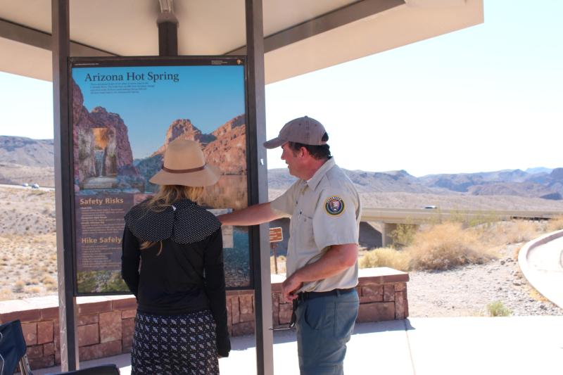 NPS Volunteer assists a park visitor