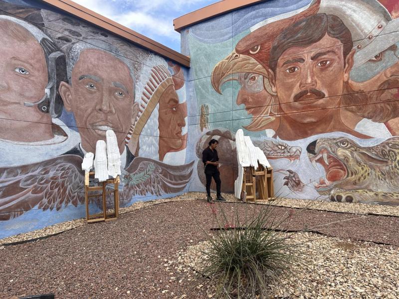An outdoor mural under an open sky.
