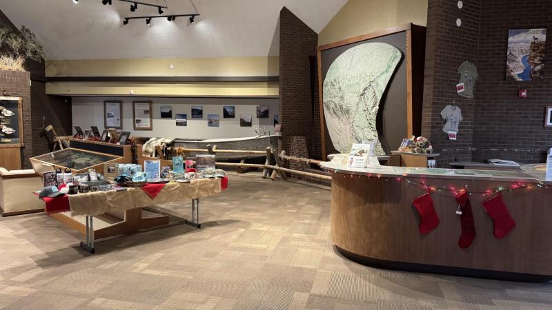 Front Desk and exhibits decorated with holiday decorations.