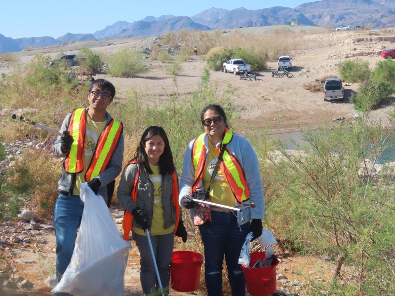Volunteers posed with approximately 15 full trash bags