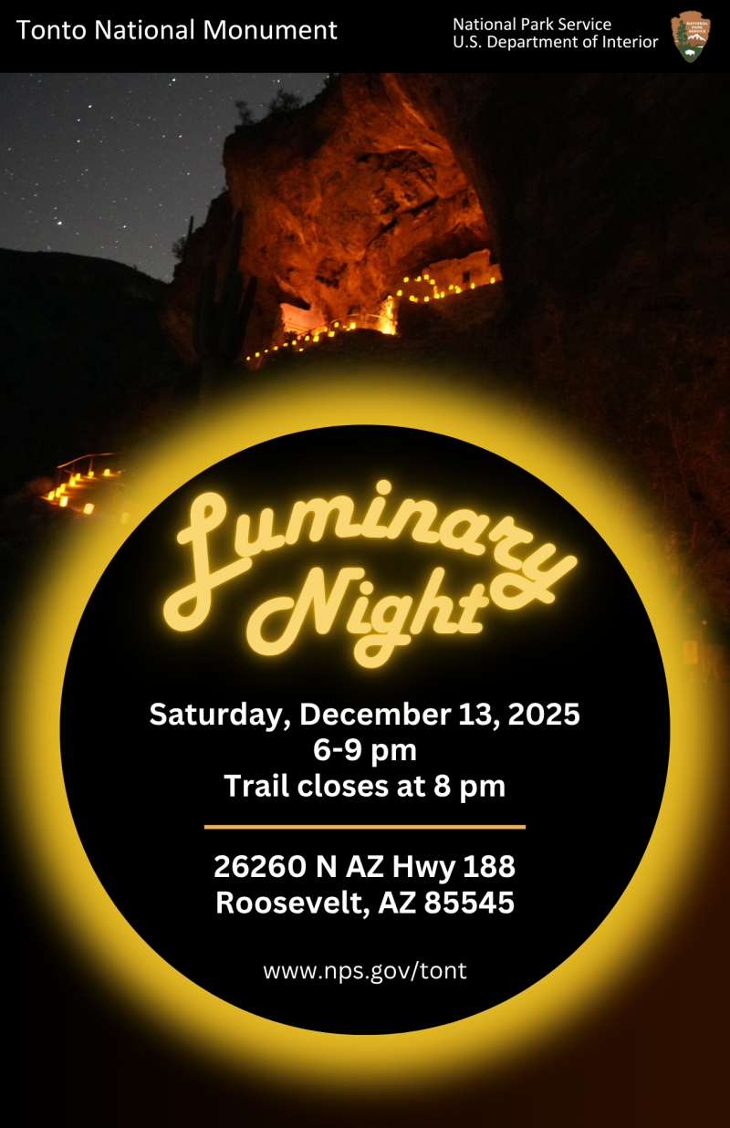 A poster of the Lower Cliff Dwellings being lit up after sunset.
