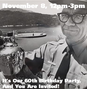 Black and white photo showing the park's first superintendent holding a commemorative jug.