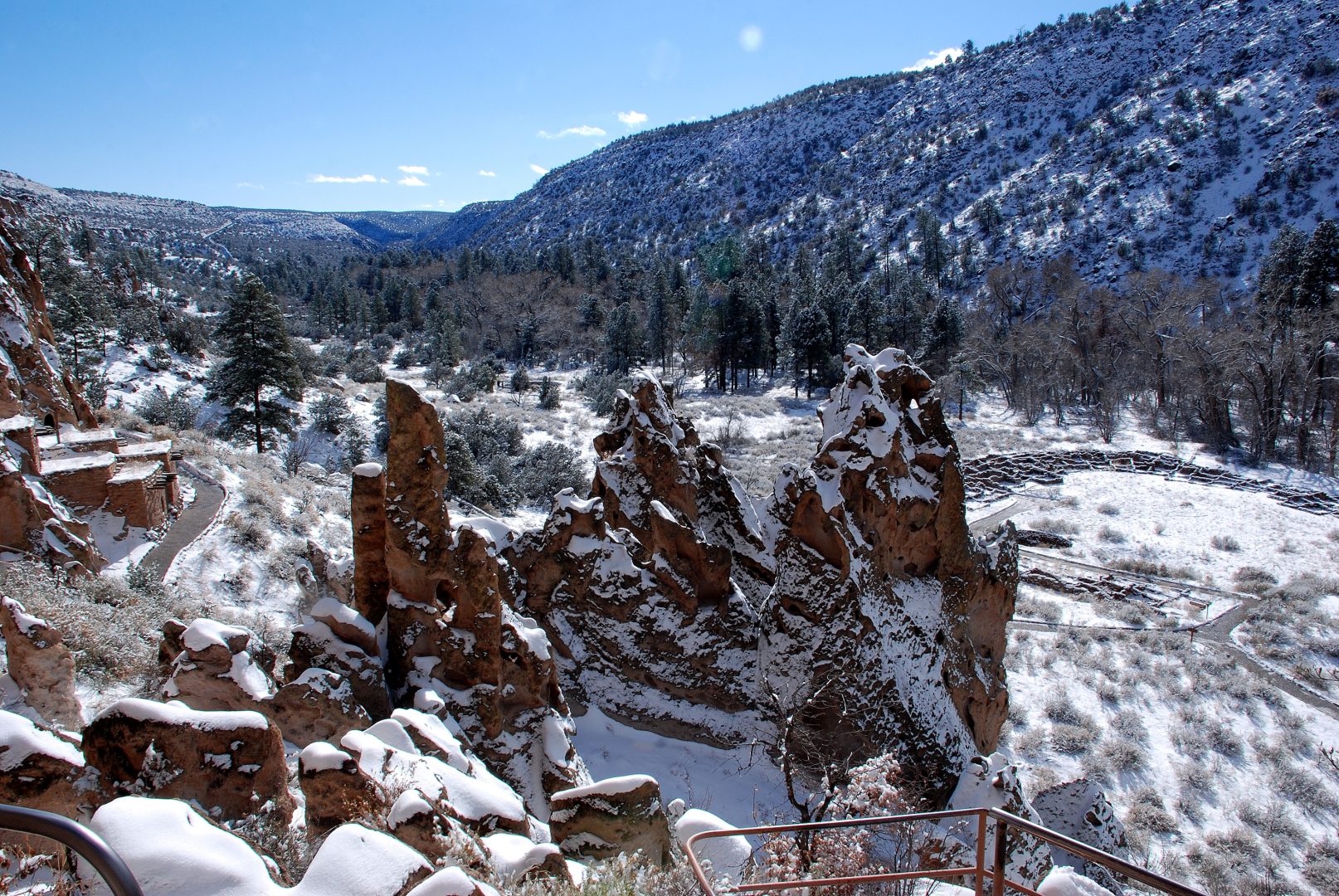Snow covers Bandelier National Monument Frijoles Canyon trees in snow